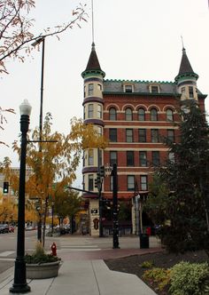 an old brick building on the corner of a street