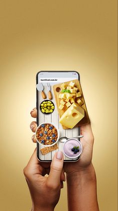 a person holding up a cell phone with food on it