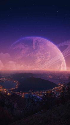 an image of planets in the sky with mountains and city lights behind them at night