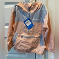 This Is An Extremely Lightweight Packable Windbreaker. The Color Is Light Salmon And Grey. Never Been Worn. Defy The Wind: - An Essential Item For All Your Childrens Outdoor Adventures, This Water-Resistant Windbreaker Gives Children The Extra Protection They Need From The Elements. Packable: - It Can Be Packed Into The Pocket And Is Thus Easy To Have In Backpacks At All Times. Features: - Water Resistant Fabric - Packable - Hand Pockets - Elastic Cuffs - Elastic Hem - Reflective Detail - Uses: Pink Outerwear For Outdoor Activities In Fall, Pink Outerwear For Fall Outdoor Activities, Pink Fall Outerwear For Outdoor Activities, Pink Nylon Outerwear For Outdoors, Pink Nylon Outdoor Outerwear, Pink Nylon Outerwear For Outdoor, Pink Hooded Outerwear For Outdoor, Pink Long Sleeve Outerwear For Outdoor, Casual Pink School Outerwear