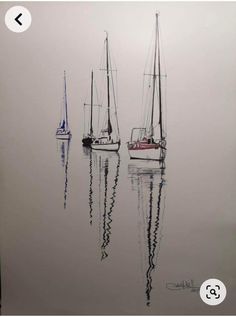 two sailboats floating in the water on a foggy day