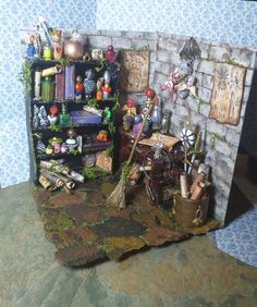 a miniature room with many items on the shelf and in front of it is a brick wall