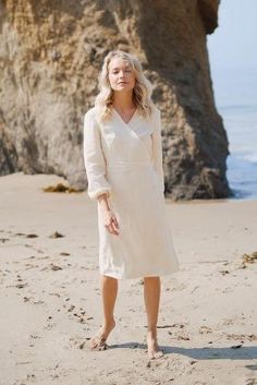 Winona wrap minimalist feminine dress for everyday. Midi length. 100% Linen. Made in California. The model is 5’7” (170cm) and wears a size XS. Fitted White Linen Luxury Dress, Luxury Summer Wrap Midi Dress, Luxury White Linen V-neck Dress, Luxury Linen Midi Dress For Vacation, Luxury Spring Linen Midi Dress, Luxury White Linen Daywear Dress, Luxury Linen Midi Dresses, Chic Luxury Linen Midi Dress, Luxury Fitted Linen Long Sleeve Dress