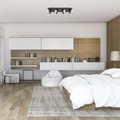 a large bed sitting in a bedroom on top of a hard wood floor next to a book shelf