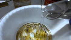 a sink filled with dirty water next to a faucet