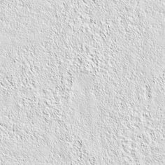 a white stucco wall textured with cement