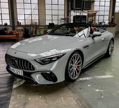 the mercedes amg gt roadster is parked in a garage