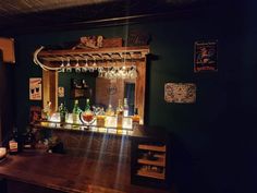 a bar with liquor bottles and lights on it