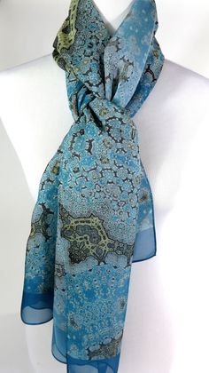 "Delivery by Christmas not guaranteed, although items are sent out very quickly. Upgrade to Priority Mail at checkout to have a better chance of pre-Christmas delivery! Fractal beauty on silk chiffon in subtle shades of light blue and gold! This lovely, long shawl/scarf recalls the complexity of Islamic art, but the pattern is actually a multi-layered fractal design. Length is 78 inches, long enough to knot and wrap almost any way you wish. The silk chiffon used for this scarf is a very tight we Elegant Blue Shawl Scarves, Elegant Blue Silk Shawl Scarf, Elegant Blue Silk Shawl, Meditation Shawl, Unique Scarf, Blue Silk Scarf, Long Silk Scarf, Shades Of Light Blue, Gold Wrap