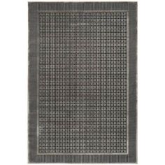 a rug with grey and white squares on the bottom, in front of a white background