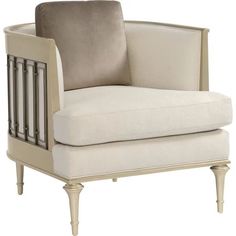 a white chair with a beige pillow on it's back and armrests