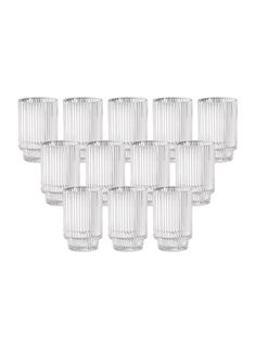 twelve clear glass tumblers are lined up in a row on a white background,