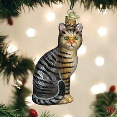 a cat ornament hanging from a christmas tree