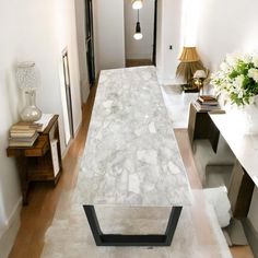 a long white marble table in the middle of a room