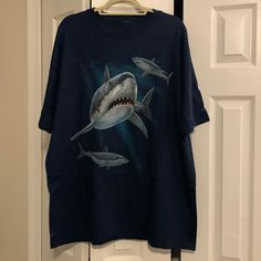 Never Worn Great White Shark Shirt From Cape May, Nj! Deep Navy Blue Color. Label And Size Tag Cut Out But Looks Like Xxl. Small White Stain On Bottom/Back Of Shirt (See Last Photo) That Should Likely Come Out In The Wash. Make An Offer! Smoke And Pet Free Home. Ocean Shirt, Shark Tee, Cape May Nj, Deep Navy Blue, Shark Shirt, Marvel Shirt, Blue Shark, White Stain, White Sharks