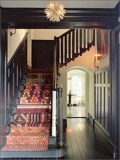 an instagram page with stairs and rugs on the floor in front of a door