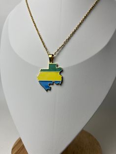 Material: 18k Gold Platted Stainless Steel Design: Gabon Map with Flag Chain Length: 45 cm or 17 inches Chain Type: Link Chain Yellow Metal Necklace With Adjustable Chain, Yellow Chain Necklace Gift, Yellow Pendant Necklace With Adjustable Chain, Yellow Box Chain Necklace For Gift, Mama Africa, Erie Pa, Steel Design, Link Chain, Chain Lengths