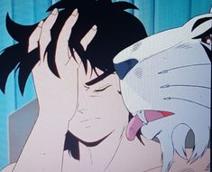 an animated image of a man kissing a cat on the forehead with his eyes closed