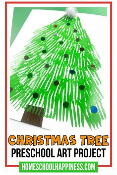 a christmas tree made out of construction paper with the words christmas tree preschool art project