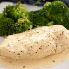 chicken breast with gravy and broccoli on a plate