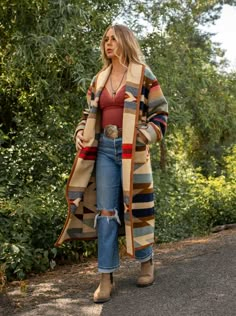 Wyeth Trail Long Stadium Coat Our Wyeth Trail Long Stadium Coat will keep you covered from top to below the knee. Made from the Pendleton Wyeth Trail wool blanket, the warm earth tone colors are easy to wear. Wear it open or close at the waist with a toggle. Designed for a slightly oversized fit and look. The Wyeth Trail blanket reflects warm, harmonious colors of ancient corn varieties patterned in rows similar to ancient Native American gardens. Arrows point in two directions, the past and the Rust Duster And Booties, Pendleton Womens Jacket, Womens Western Outerwear, Western Hoodies Ranch Dress'n Western Boutique, Western Wear Coats & Jackets, Blanket Coat Pendleton Woolen Mills, Luxury Fitted Outerwear For Rodeo, Beth Dutton Coats & Jackets, Pendleton Wool Jacket