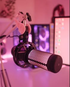 a microphone sitting on top of a table next to a computer