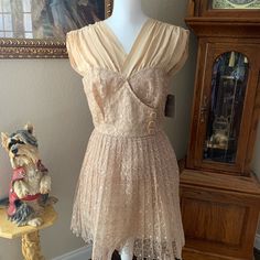 This Is A New Party, Wedding, Dance Dress! It Is Beautifully Embroidered And The Color Is Biscuit. Parts Of It Are Silk ,But Not Sure The Skirt Material? It’s Kind Of Stiff Material That Holds Its Shape But Not Too Stiff And Is Lined. Has Cute Buttons On The Front And Extra. Summer Wedding Vintage V-neck Dress, Beige Vintage V-neck Dress, Party Dresses With Lined Bodice In Cream, Fitted Lace Dress For Spring, Spring Wedding Vintage Dress With V-neck, Cream Dress With Lace Trim And Sweetheart Neckline, Cream Lace Trim Dress With Sweetheart Neckline, Cream Lace Party Dress, Sleeveless Fitted Vintage Dress For Casual Wear