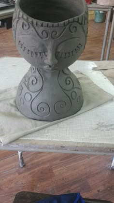 a large vase sitting on top of a table