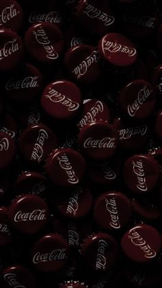 coca - cola bottle caps are seen in this image