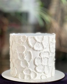 a close up of a white cake on a plate