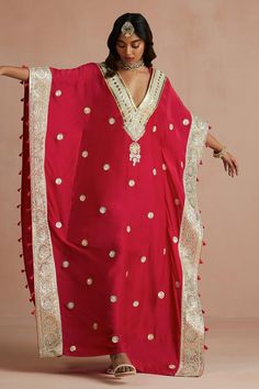 Crimson magenta kaftan with floral gota embroidery and tassel detailing. Paired with slip.
Components: 2
Pattern: Embroidered
Type Of Work: Floral
Neckline: V neck
Sleeve Type: Kaftan sleeves
Fabric: Kaftan: Pure Muslin, Slip: Shantoon
Color: Red
Other Details: 
Kaftan sleeves
Tassels detailing
Length:
Kaftan: 54 inches
Slip: 48 inches
Occasion: Puja - Aza Fashions Floor-length Kaftan For Navratri Ceremonies, Red Dabka Kaftan For Traditional Ceremonies, Wedding Kaftan With Gota Work For Festivals, Red Kaftan For Eid Traditional Ceremonies, Wedding Kaftan With Dabka For Transitional Season, V-neck Traditional Wear For Eid, Floor-length Pallu Kaftan For Traditional Ceremonies, Floor-length Kaftan With Pallu For Traditional Ceremonies, Kaftan With Dupatta For Traditional Ceremonies And Festivals