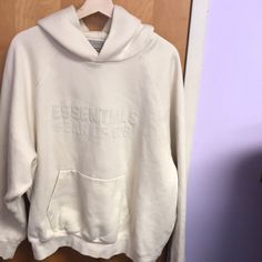 Questions? Leave A Comment Below! Very Good Condition Preowned Light Beige Hoodie Embossed In Front No Rips Tears One Small Spot On Cuff See Closeup Slight Discoloration On Fold Of Hoodie On Left Side - See Closeup 80 Cotton/20 Polyester God Shirts, Beige Hoodie, Fear Of God Essentials, Fear Of God, Mens Essentials, Light Beige, Hoodies Men, Mens Shirts, Man Shop