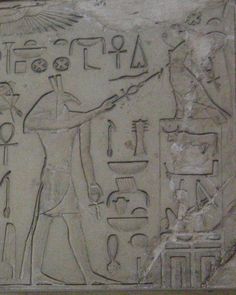 an egyptian relief depicting the god horus