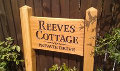 a wooden sign that says revves cottage private drive