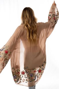 Nothing is more fun than a kimono covered in floral! This perfect layering piece features a sheer fabric in a longline silhouette with accents of crochet florals in multicolors along the hem and wide sleeves.Model is 5'4" and wearing a one size.100% Polyester Hand wash cold, Lay flat to dry. OS sizing fits most* sizes US 0-18Length: 38 inBust Across: 25 inSleeve Length: 17 inSleeve Opening: 11 in Import Kimono And Jeans, Ceremonial Clothing, Beautiful Kimonos, Print Kimonos, Sheer Fabric, Bohemian Clothes, Wide Sleeves, Sheer Fabrics, Layering Pieces