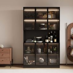 a living room with a large bookcase filled with bottles and other items next to a dresser