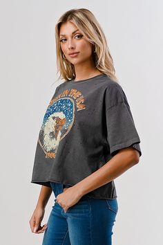 Born in the USA OVERSIZED 80's vibe distressed Cropped T- shirt available in faded black This Crop Jersey Tee slides right into streetwear style for Summer and Winter.. With oversized sleeves and a relaxed body, this on-trend tee drops a little lower in the back for an effortlessly cool feel. Fabricated from ultra-soft, lightweight Airlume cotton that's fit to flatter, this looser crop features a finished hem and neck binding.Features: Finished hem. Oversized sleeves. Neck binding. Relaxed body. Retro Distressed Short Sleeve Tops, Vintage Distressed Tops With Relaxed Fit, Vintage Relaxed Fit Distressed Top, Vintage Distressed Top With Relaxed Fit, Distressed Band Merch Tops With Relaxed Fit, Black Crew Neck Top With Frayed Hem, Graphic Tee With Frayed Hem And Short Sleeve, Retro Distressed Tops For Concert, Acid Wash Short Sleeve Tops With Frayed Hem