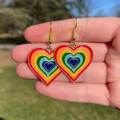 Pair of Red Rainbow Heart Dangle Earrings * Lightweight * Nickel Free and Hypoallergenic * Super cute and trendy Retro Hypoallergenic Earrings For Gift, Trendy Colorful Heart-shaped Jewelry, Rainbow Retro Jewelry For Gift, Trendy Multicolor Dangle Heart Earrings, Retro Rainbow Colored Jewelry Gift, Colorful Retro Earrings For Gift, Trendy Multicolor Heart Dangle Earrings, Retro Earrings For Valentine's Day Gift, Retro Rainbow Jewelry Gift