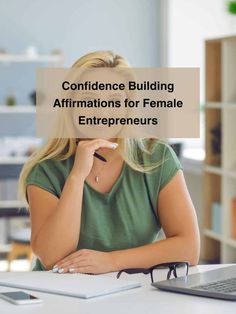 a woman sitting in front of a laptop computer with the words,'conference building affirm