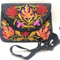 "Beautiful Floral Embroidered Shoulder Bag perfect for every occasion.  Create a wow moment by uplifting any plain outfit with a splash of color.  Makes great gifts-Birthdays, Anniversaries etc. STYLE: FBM-KVE-250 BN836-120519 Features: Style: Flower Embroidered Shoulder Bag Strap: 1\" Adjustable Size: 9\" x 6\"  Pockets: 3  Closure: Main pocket with zip closure. Loose change pocket inside the main compartment with zipper closure. Another Pocket with Zipper Closure Material: Imported Suede Leath Black Bags With Floral Embroidery For Spring, Black Festival Bag With Floral Embroidery, Black Embroidered Shoulder Bag For Festivals, Black Embroidered Bags For Festivals, Casual Multicolor Embroidered Bag, Casual Multicolor Embroidered Shoulder Bag, Casual Embroidered Shoulder Bag As Gift, Embroidered Black Shoulder Bag As Gift, Casual Embroidered Shoulder Bag For Gift