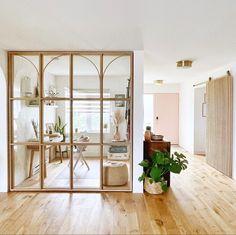 a living room filled with furniture and wooden floors