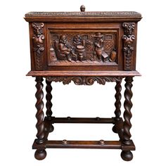 an old wooden table with carvings on it