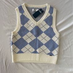 Hollister Women’s Sweater Vest, White And Blue Plaid Size S, Perfect Condition Never Worn, Tags Still On Preppy Blue Cotton Sweater, Blue V-neck Preppy Tops, Preppy Blue V-neck Top, Plaid Sweater Vest, Blue Sweater Vest, Blue Stain, Plaid Sweater, Vest White, Hollister Tops