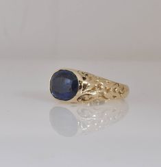 "Wide unique gold statement ring. Hand made, 14k solid gold ring with beautiful blue Kayanite. This special hand carved wide solid gold ring is a perfect fine jewelry gift for a special person you care about and love. The ring sides are decorated with delicate eastern-romantic ornaments and through them you can see the blue shade of the Kayanite. The ring is 14k solid gold, completely handmade by me in a unique wax engraving technique, I can make this ring in rose or white gold. * The ring is 14 Unique 14k Gold Oval Sapphire Ring, Unique Oval Sapphire Ring In 14k Gold, Luxury Blue Carved Jewelry, Luxury Carved Blue Jewelry, Blue 14k Gold Signet Ring As Gift, Blue Oval Signet Ring Stamped 14k, Blue 14k Stamped Oval Signet Ring, Oval Blue Signet Ring In 14k Gold, Blue 14k Gold Signet Ring With Gemstone