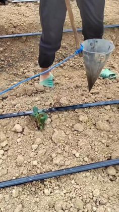 a man is shoveling dirt with a bucket