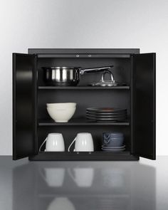 an open cabinet with dishes and cups on it