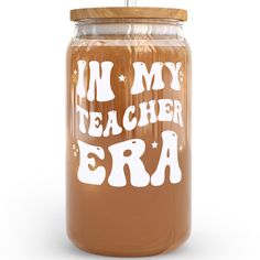 a glass jar with the words i'm my teacher era written on it and a wooden lid