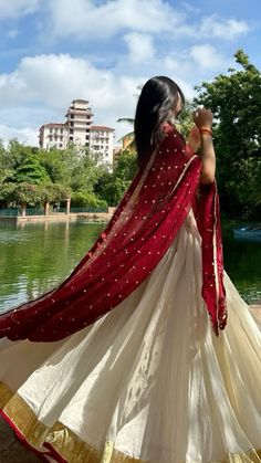 White and maroon half saree Half Saree Poses Aesthetic, Onam Half Saree, Maroon Half Saree, Half Saree Poses, Onam Skirt And Top Designs, White Half Saree, Half Saree Designs Simple, Indian Traditional Aesthetic, Indian Half Saree