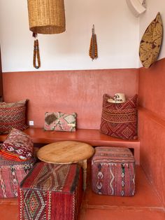 a living room filled with lots of colorful pillows