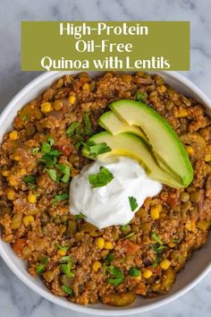 a bowl filled with beans, corn and avocado on top of a table